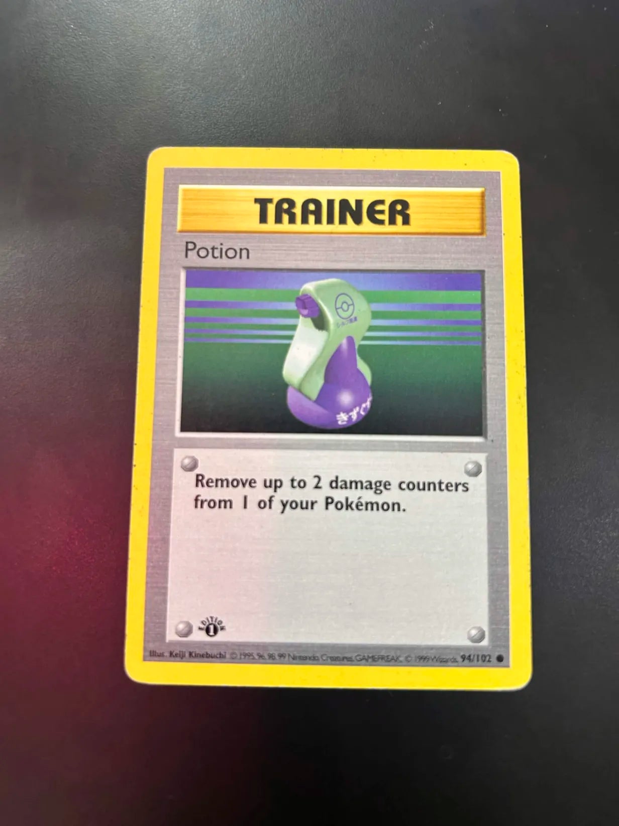#94 1st Edition Pokemon Base Set-Potion Non-holo (DMG)